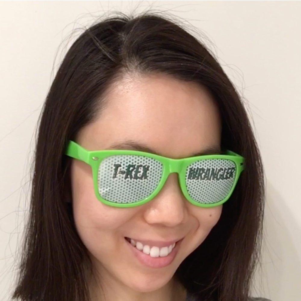 Funny Green Sunglasses with "T-Rex Wrangler" text
